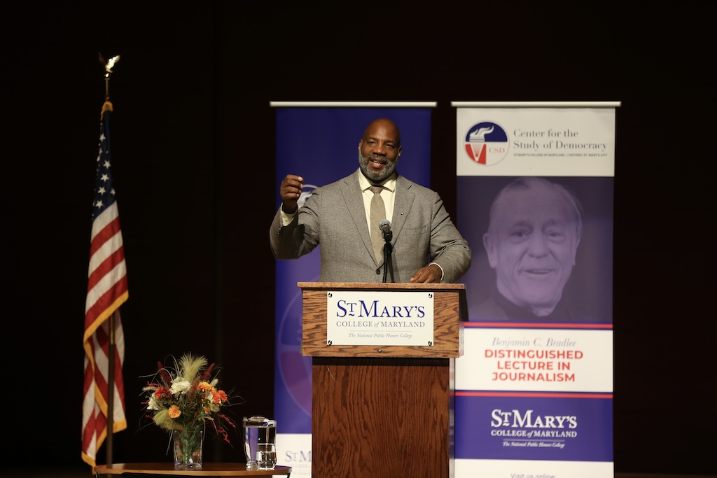 Image of a man at a podium speaking