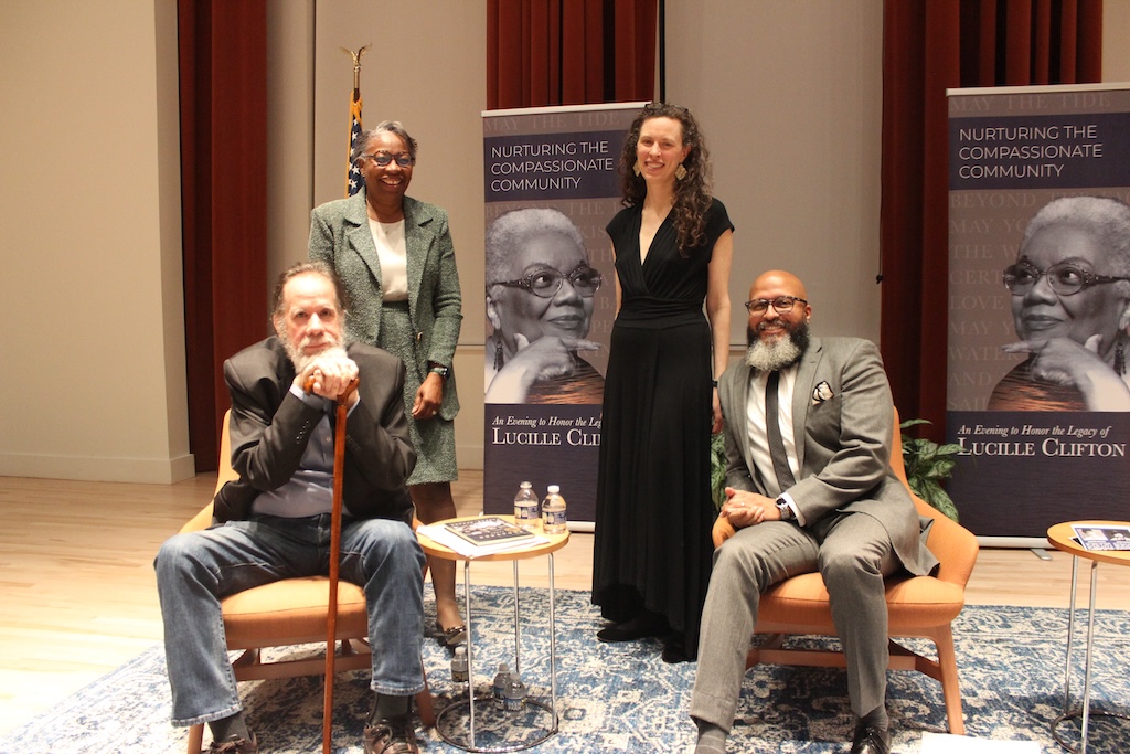 Image of 4 people, some sitting in the Dodge Performing Arts Center