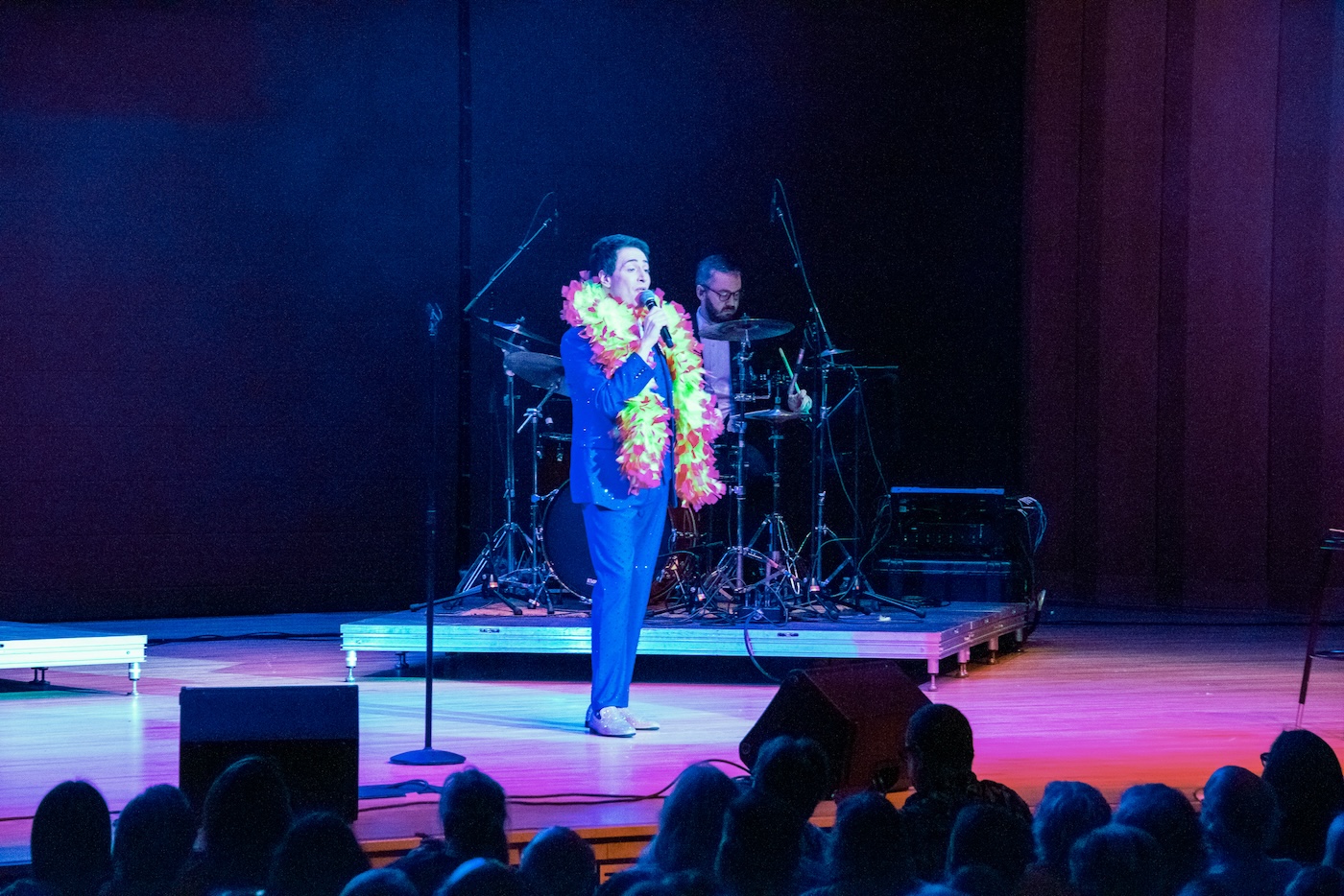 Randy Rainbow standing on a stage in front of a crowd