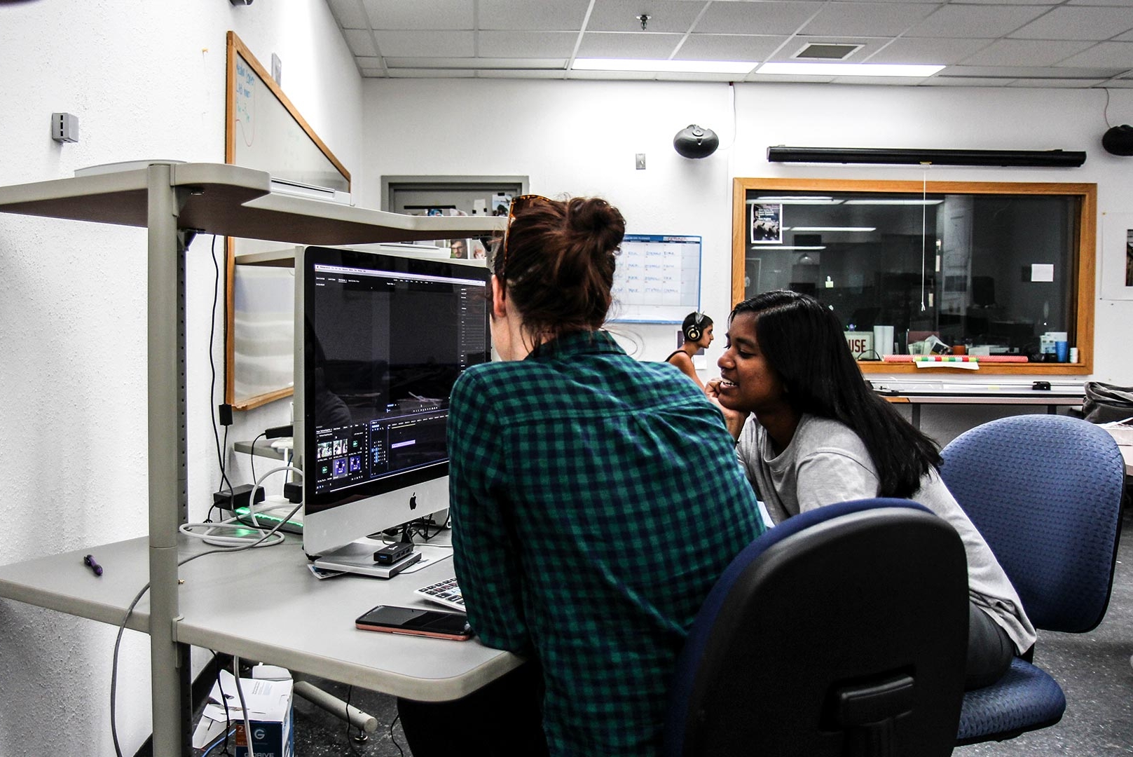 SMCM students work on an iMac video editing rig in the Media Center on the third floor of the Hilda C. Landers Library.