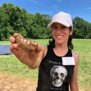 Excited student shows her archeological findings