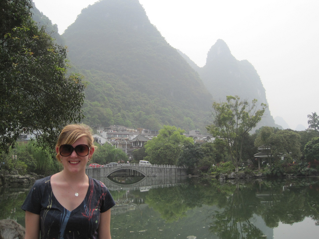 A student standing in front of a vista in China